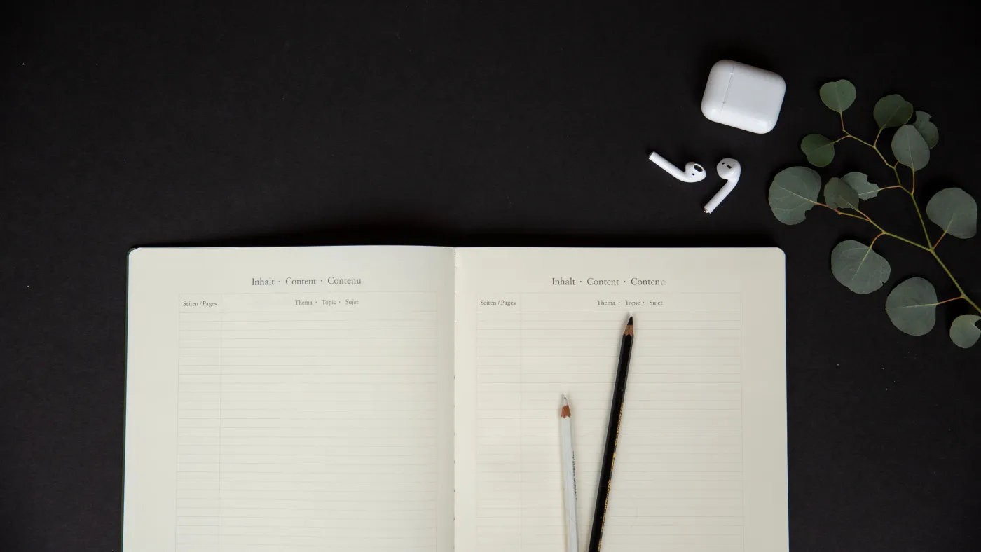 Open planner with pen on a desk for printable product inspiration