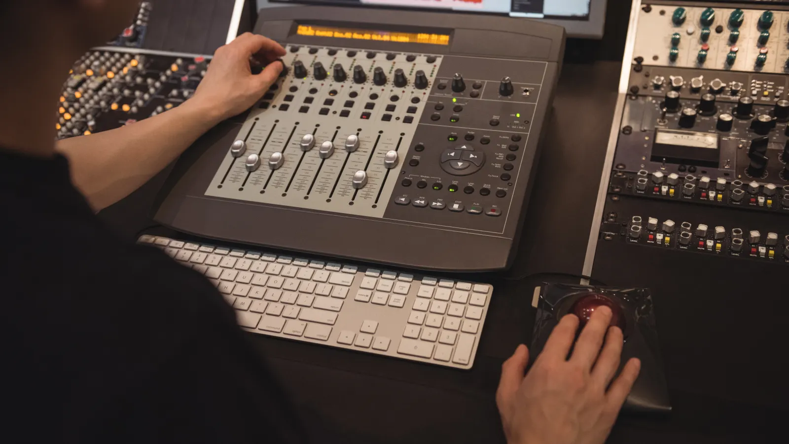 Music producer working on digital products in a home studio